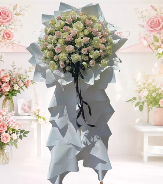 Bó hoa chia buồn hồng phấn trắng nơ đen