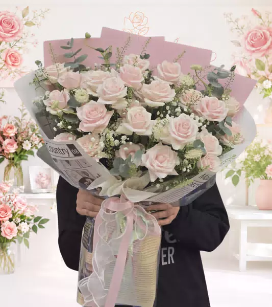 Bó hoa hồng phấn gói giấy báo