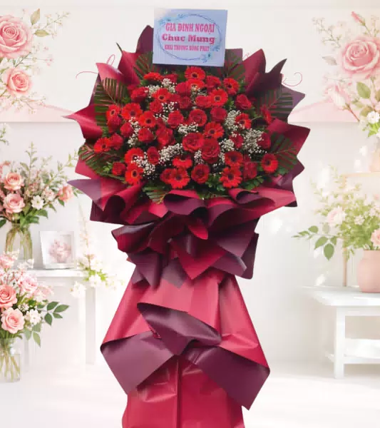 Kệ hoa khai trương đỏ cúc đồng tiền kèm bảng chúc mừng