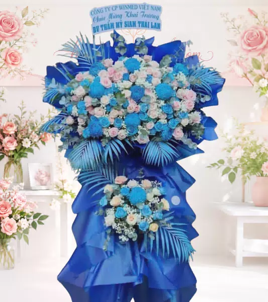 Kệ hoa khai trương xanh dương phối hồng kèm bảng chúc mừng