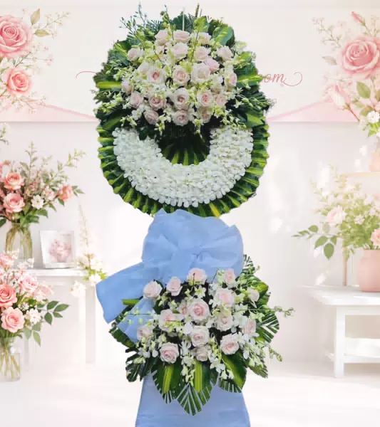 Kệ hoa tang lễ hồng phấn lan trắng nơ xanh dương