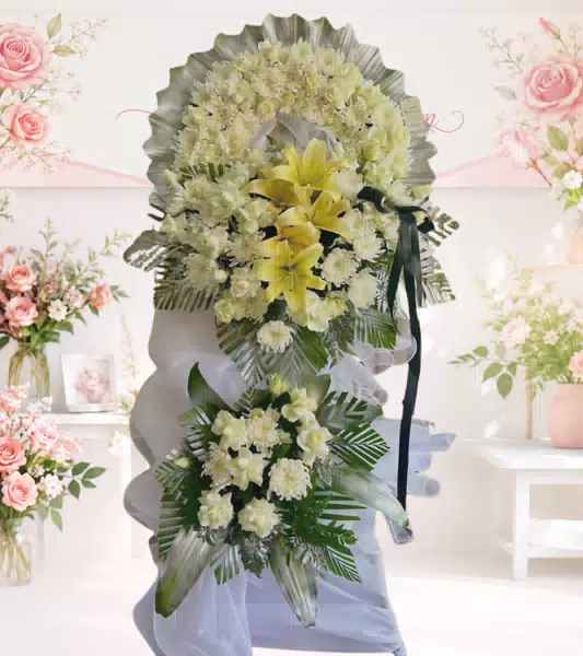 Kệ hoa tang lễ lily vàng cúc trắng nơ đen
