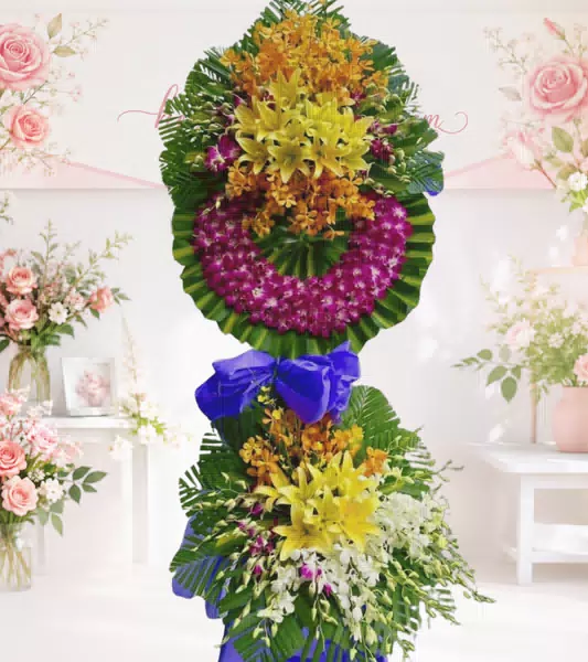Kệ hoa tang lễ lily vàng lan tím cam nơ xanh dương