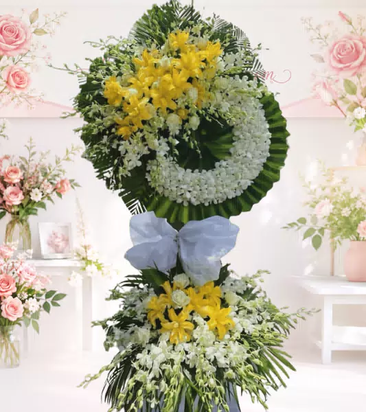 Kệ hoa tang lễ lily vàng lan trắng hai tầng nơ xanh
