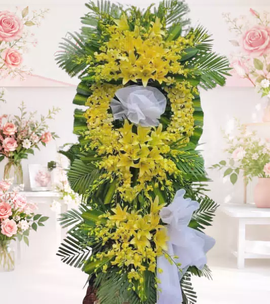 Kệ hoa tang lễ lily vàng lan vàng nơ trắng