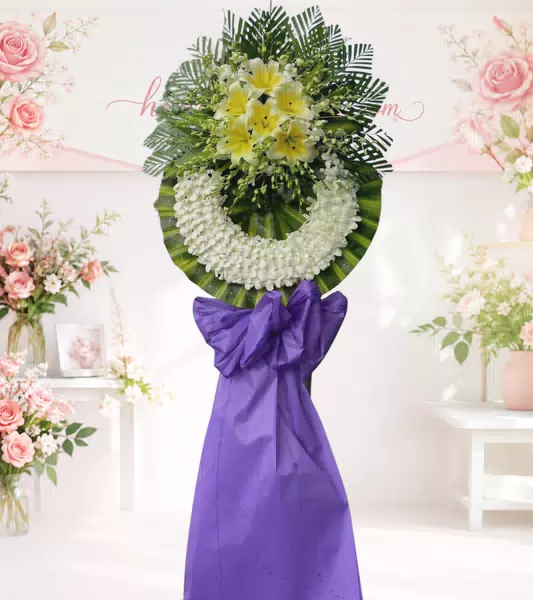 Kệ hoa tang lễ lily vàng nơ tím