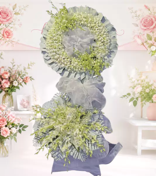 Vòng hoa chia buồn tone trắng hai tầng nơ xanh nhạt