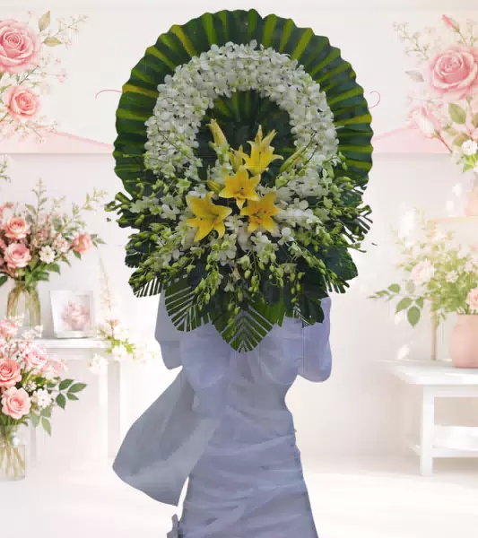 Vòng hoa tang lễ lan trắng lily vàng nơ trắng dáng nghiêng